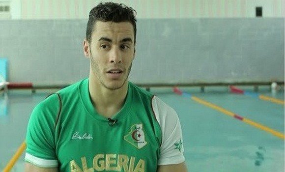 صورة مرتبة ثالثة للجزائري أسامة سحنون في سباق 100م فراشة